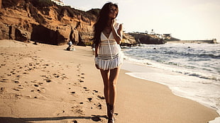 woman walking on beach HD wallpaper