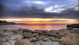 time lapse photography of stones on seashore