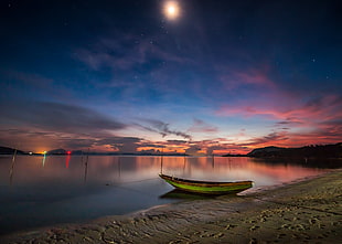 photo of boat on seashore