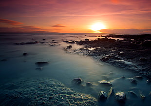 body of water near stone