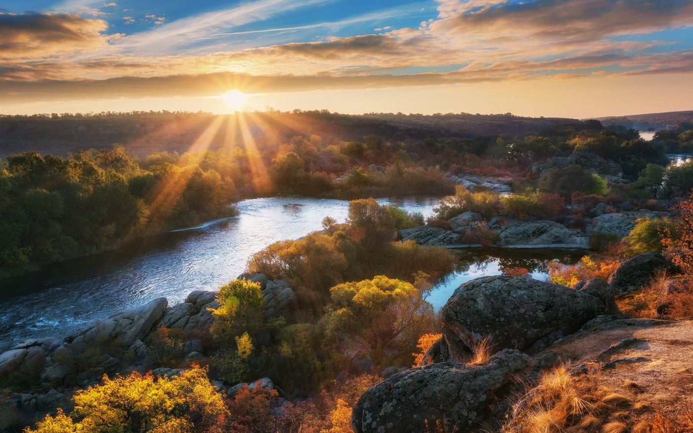 aerial photography of osea near body of water at sunset