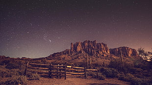 brown hill, desert, night, stars, rock HD wallpaper