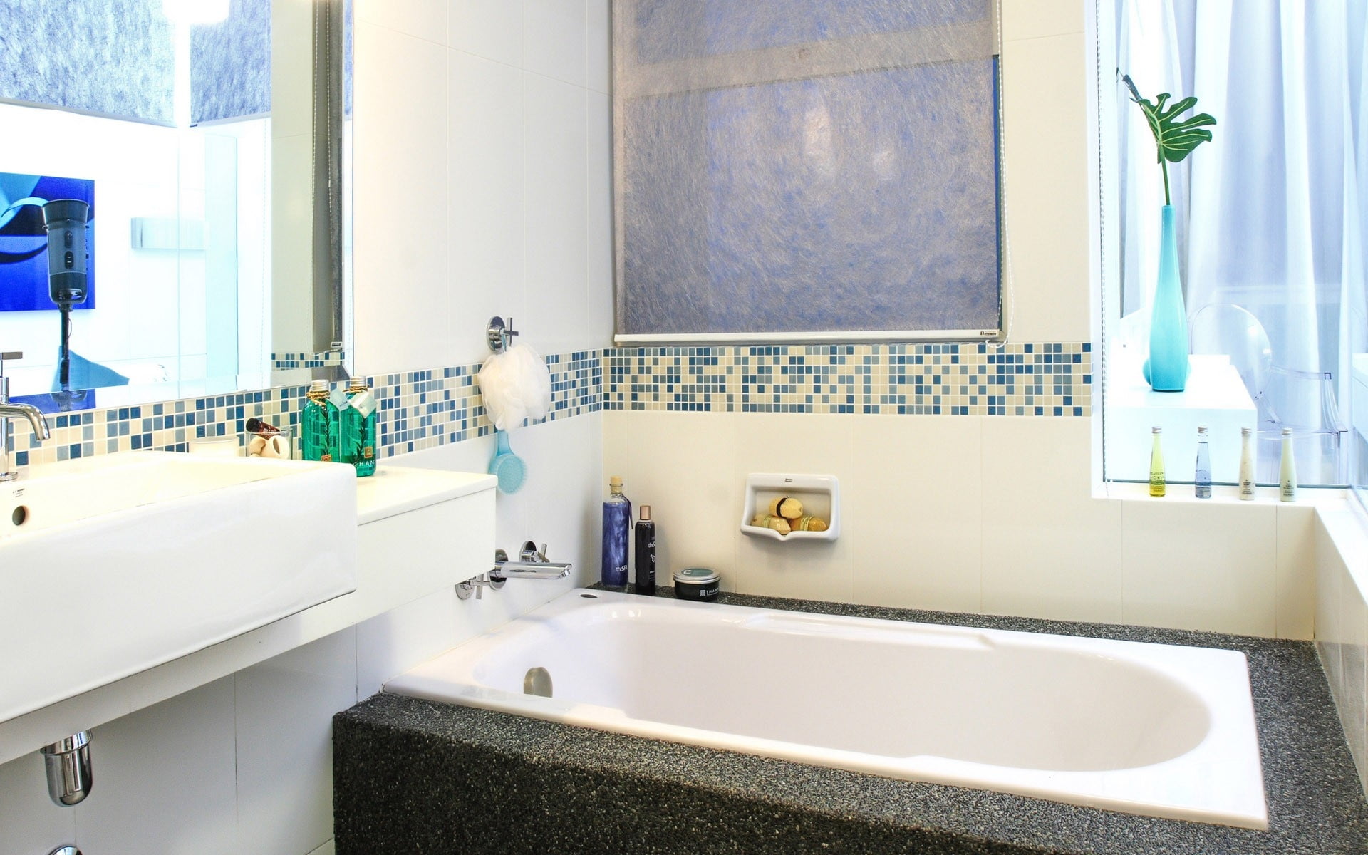 white bathtub inside white room