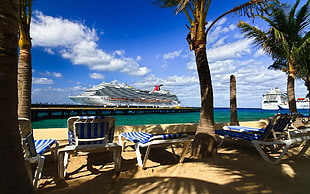 four white-and-blue striped loungers, landscape, sea, water