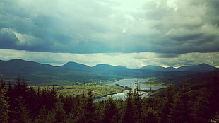 body of water across mountain