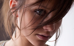 woman wearing silver ring earrings