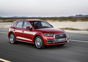 timelapse photography of red Audi Q series along highway