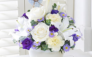 white and purple petaled flower arrangement