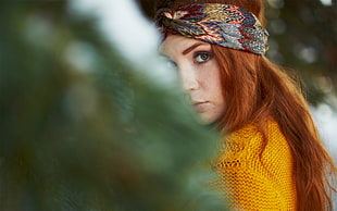 selective focus photography of woman wearing orange top and gray-white-and-black bandana HD wallpaper