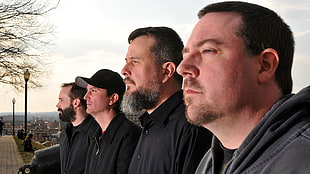 four man wearing black jackets HD wallpaper