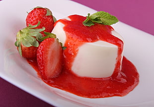 strawberry cheesecake served on white plate HD wallpaper
