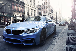 blue BMW coupe at city street during daytime HD wallpaper