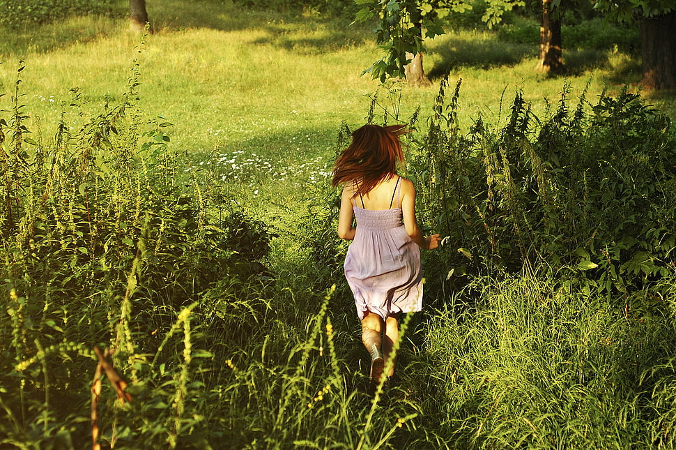 woman in brown spaghetti strap dress running on grass field HD wallpaper