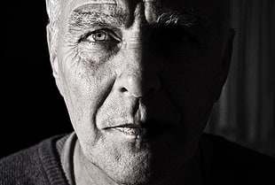 grayscale photo of man wearing shirt