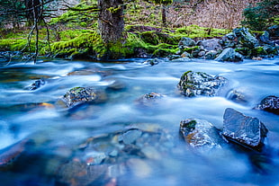 gray concrete stones on body of water HD wallpaper