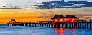 landscape photo of boat docking during sunset, naples