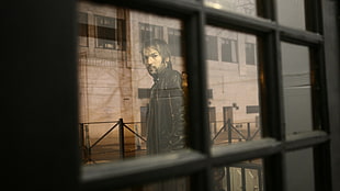 black frame window overlooking man wearing black leather jacket HD wallpaper