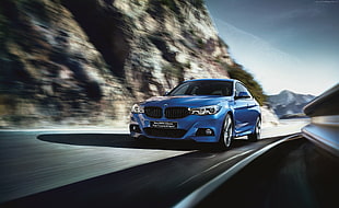 time lapse photography of blue BMW car