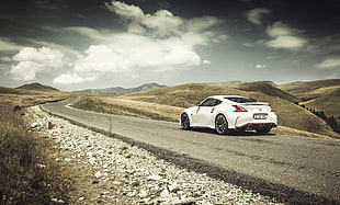 white coupe on empty road HD wallpaper