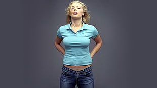woman in blue polo shirt