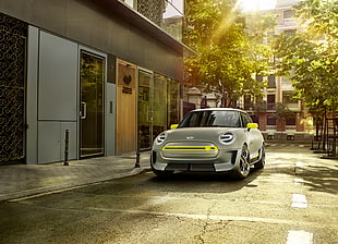 gray Mini Cooper parked beside gray painted building HD wallpaper