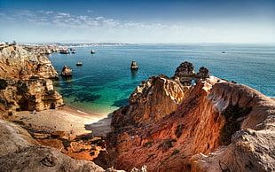 brown hill and body of water, nature, sea, rock, stones