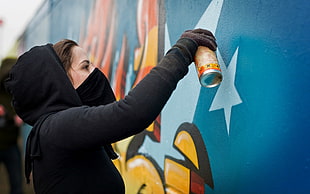 woman painting the wall during daytime HD wallpaper