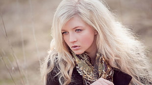 woman wearing green and white infinity scarf