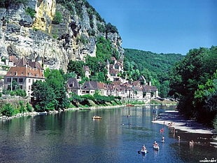 village beside body of water, city, water