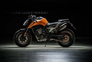 orange and black naked sports bike HD wallpaper