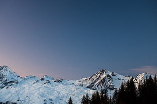 mountain with snow on top under blue sky at daytime