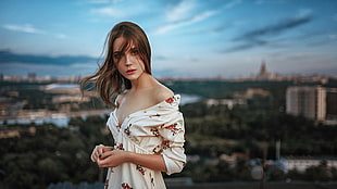 woman wearing white, red, and green floral off-shoulder 3/4-sleeved v-neck dress selective focus photograph HD wallpaper