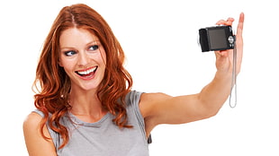 woman wearing gray tank top holding black compact camera HD wallpaper