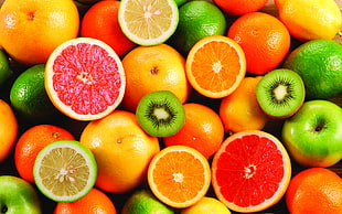 green Kiwi, orange, and green lemon fruits HD wallpaper