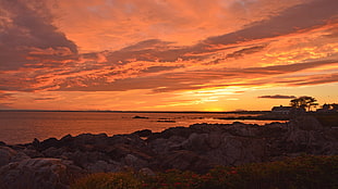 body of water and rock formations, sunset, beach, clouds