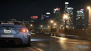 black car on road during night time