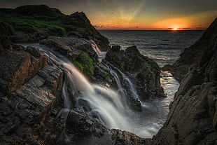 water falls during sunse HD wallpaper