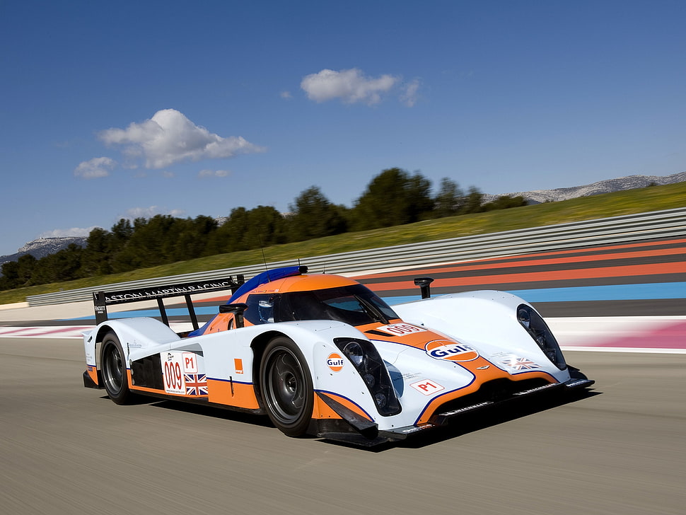 time lapse photography of orange and white racing car HD wallpaper