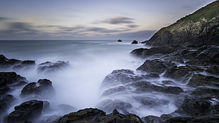 time lapse photography of falls with fog