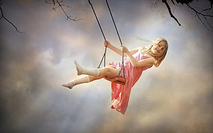 girl wearing pink dress swinging on tree during daytime HD wallpaper