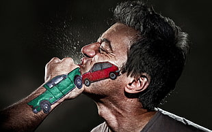 man being punched with cars painted on face and hand HD wallpaper
