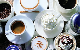 photography of teacup with saucer lot on table