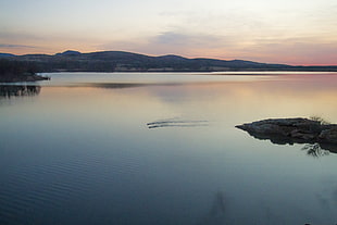 blue and brown lake near mountain hills during sunset, quanah