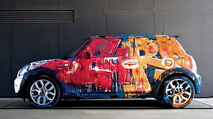 multicolored 5-door hatchback, graffiti