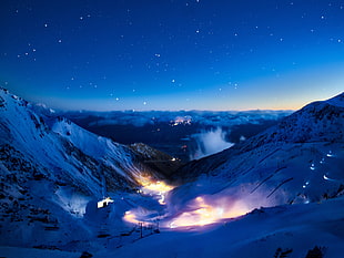 silhouette photo of fire on mountains during nighttime