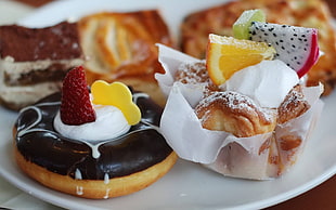 assorted foods serve in white ceramic plates