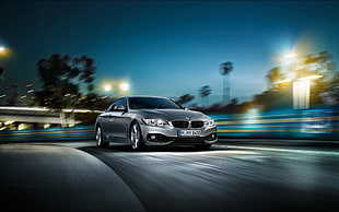 black BMW coupe on road during night time