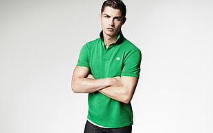 man wearing green polo shirt