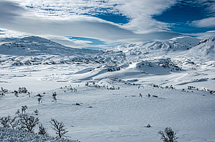 mountains filled with snow under white and blue clear sky HD wallpaper