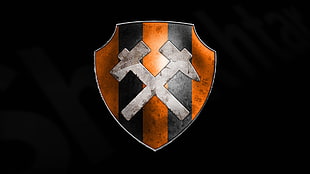 black, orange, and silver badge